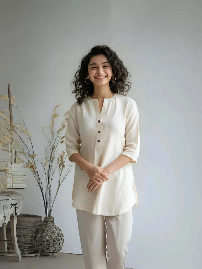 Ecru airy linen short kurta for women, featuring a stylish design and comfortable fit